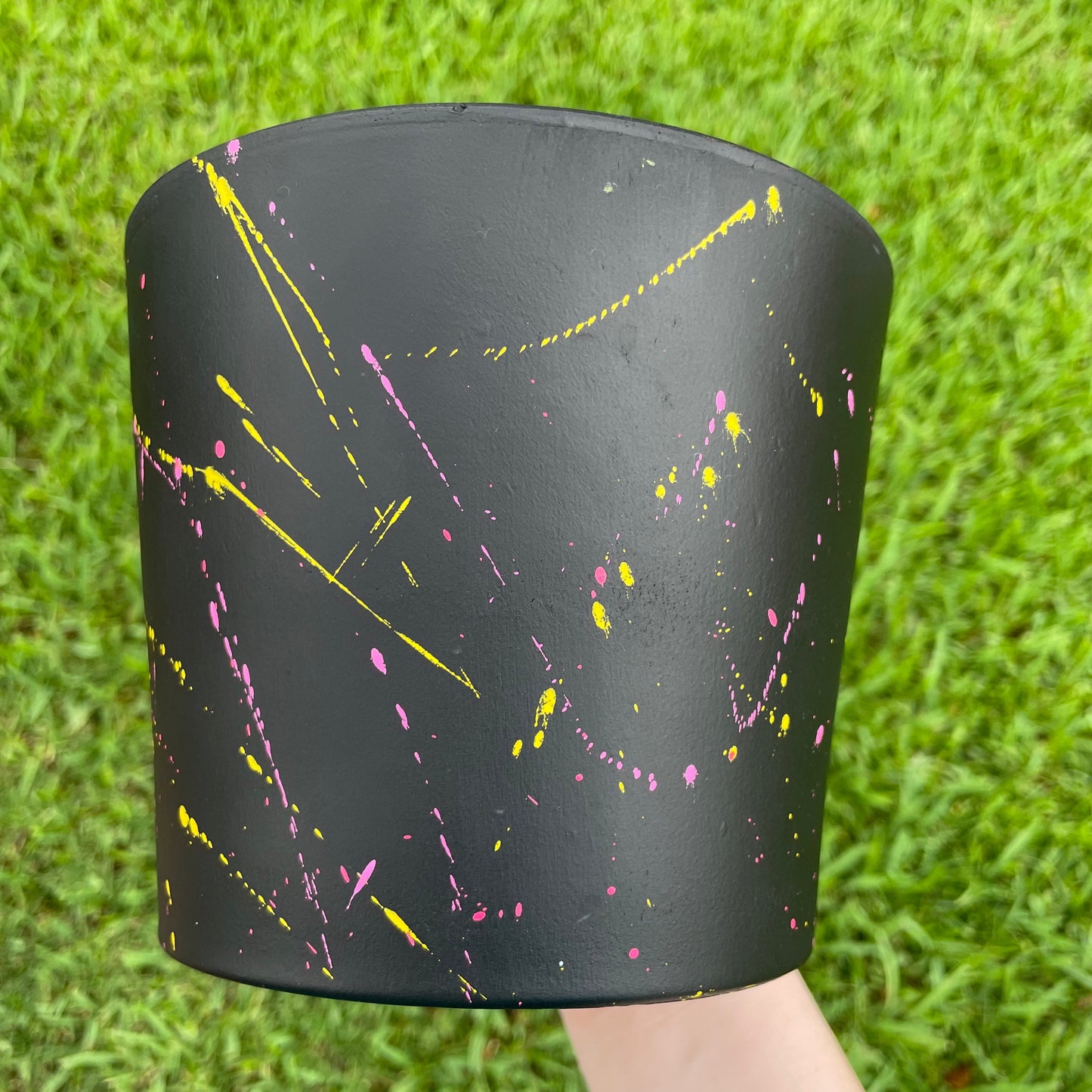 6.5-inch matte black terracotta pot depicting a hand-painted SpongeBob in love design.