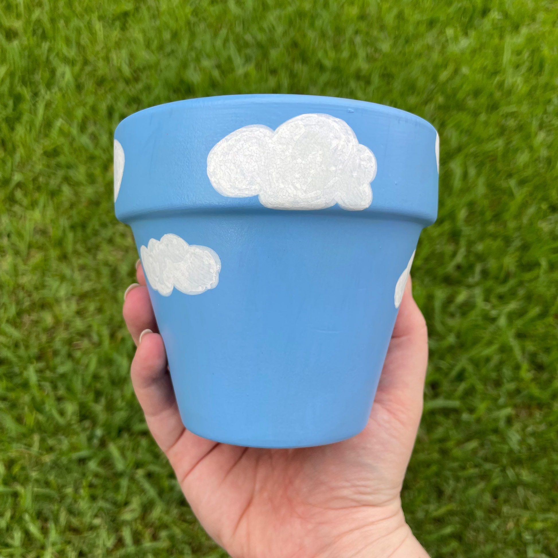 4-inch terracotta pot with a 180-degree hand-painted design of Snoopy.
