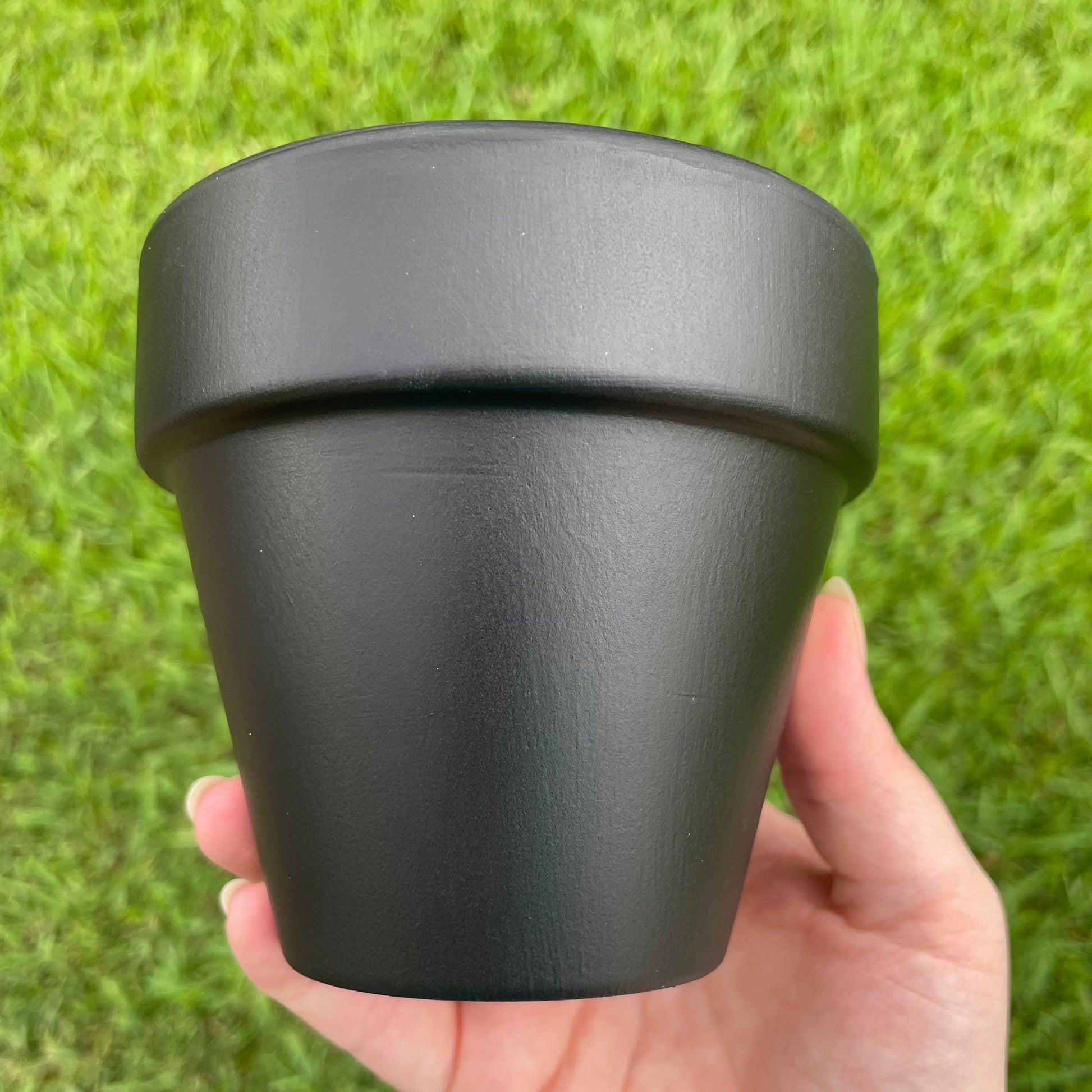 4-inch matte black terracotta pot adorned with hand-painted sunflowers.