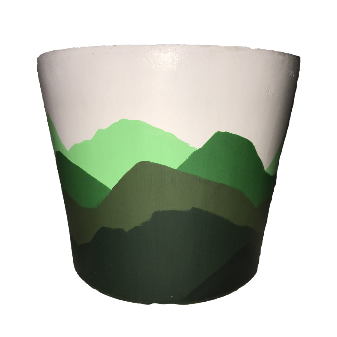 hand-painted terracotta pot featuring a 360° landscape of green mountains on a warm tan background. This unique, earthy design is perfect for nature lovers, adventure seekers, or anyone who enjoys minimalist, rustic decor. 