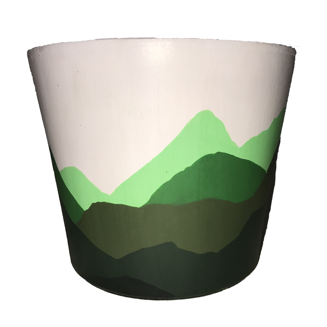  hand-painted terracotta pot featuring a 360° landscape of green mountains on a warm tan background. This unique, earthy design is perfect for nature lovers, adventure seekers, or anyone who enjoys minimalist, rustic decor. 